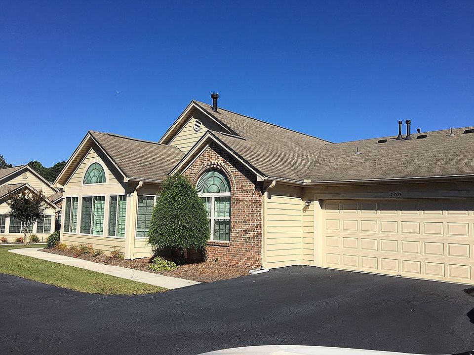 Side of condo with garage