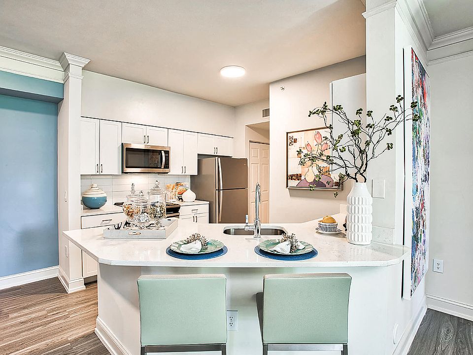 Brand new kitchens feature stainless steel appliances, quartz countertops and custom cabinetry