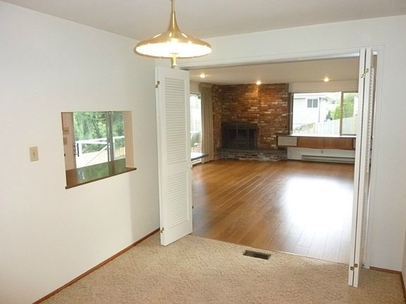 Dining "L" with kitchen pass thru and access to spacious family room.