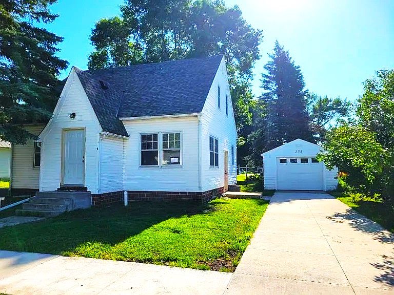Front of the house, driveway and garage.