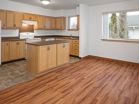 The island allows for additional counterspace as well as storage.