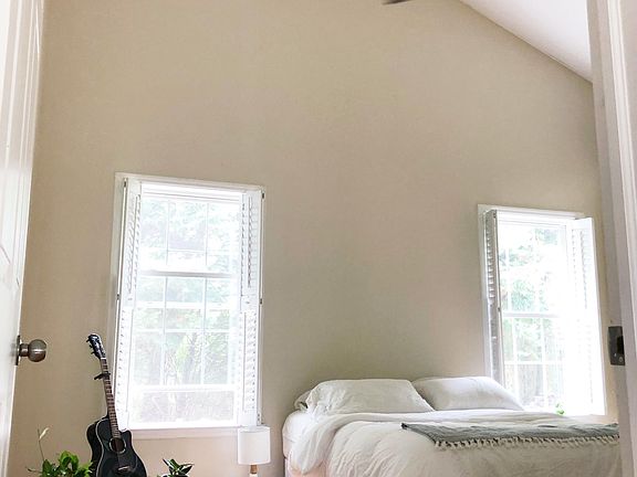 Spacious master bedroom with vaulted ceilings.