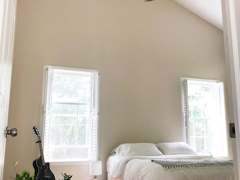 Spacious master bedroom with vaulted ceilings.