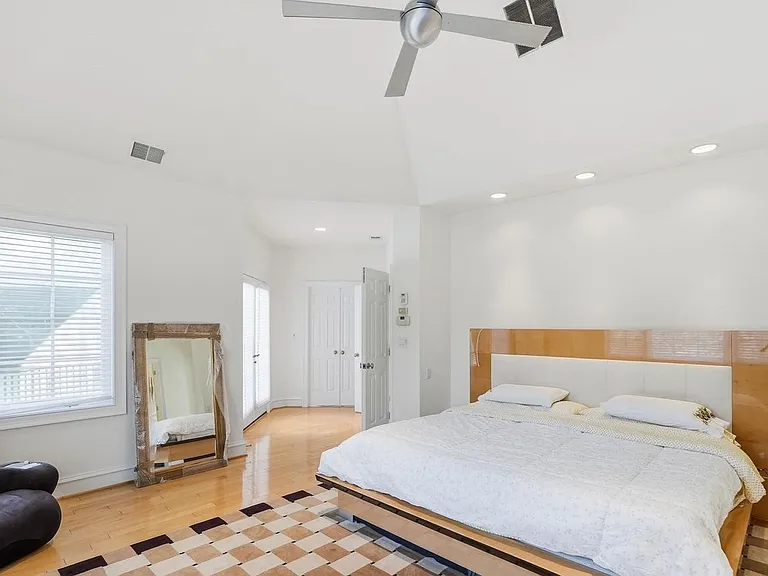 Spacious, serene primary bedroom retreat.