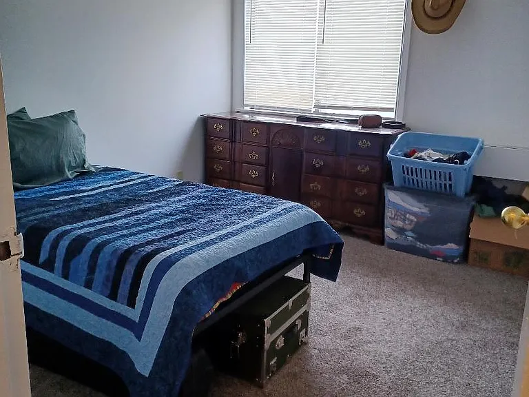 Comfortable Bedroom has a wall of closet with 2 doors.