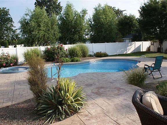 Think summer with a gorgeous built-in swimming pool and hot tub