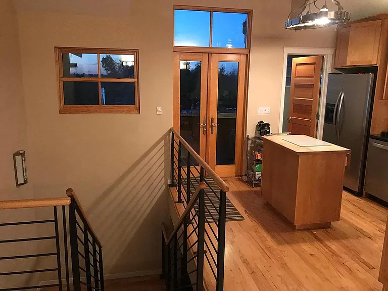 Kitchen and stairs looking north.