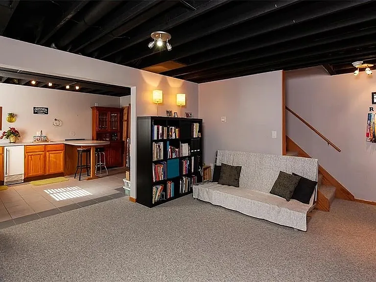 Basement space is perfect for office or rec room. Not shown - next to the kitchenette there is a large space with built-in shelves for storage.