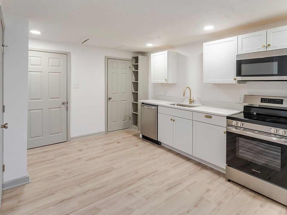 Kitchen with dishwasher, range, microwave and refrigerator