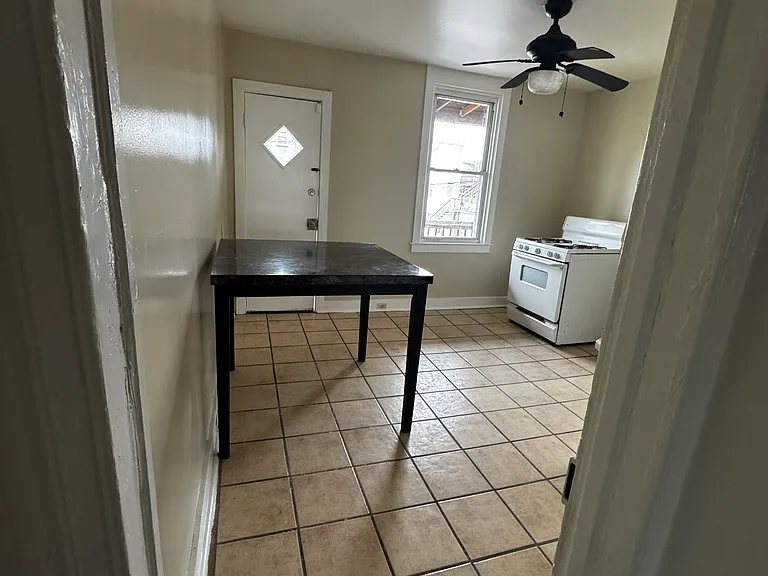 Kitchen vantage point is taken from the hallway leading into the kitchen.
