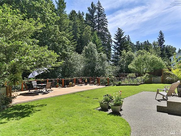 Large composite deck provides a wonderful space for outdoor entertaining and gives off a tree-house feel. Raised garden beds, in-ground automatic sprinklers and an 8'x8' storage shed complete the backyard.