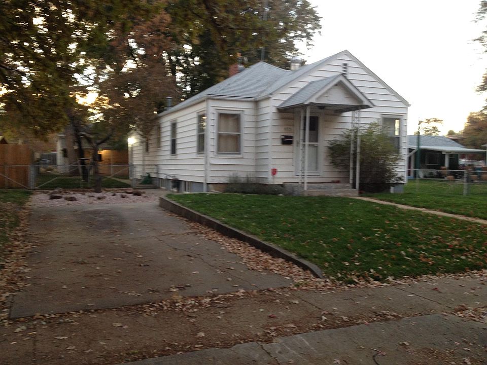 Street view of house, back building is garage with alley access.