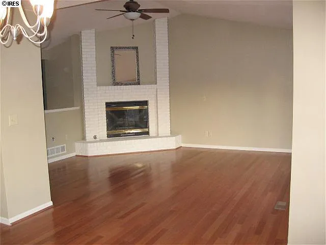 fire place and cherry hardwood floors