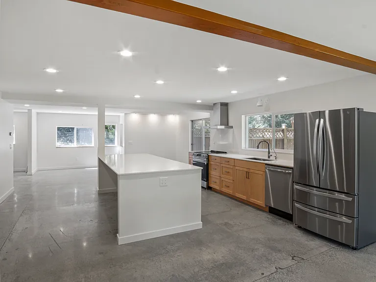 Open Concept Kitchen with Stainless Steel Appliances and Great Natural Light