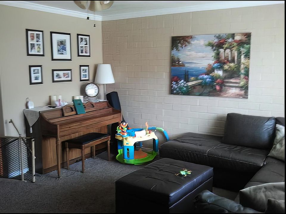 Spacious living room (This shows a little less than half of the room)

You can see it fits a sectional and piano easily.