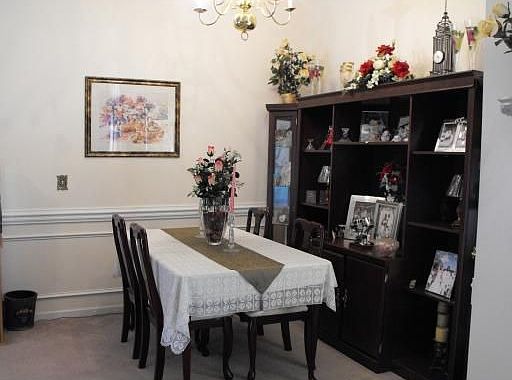 Separate dining room with chair rail