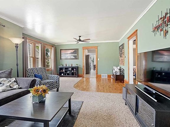 Massive first floor living room is lined with windows!