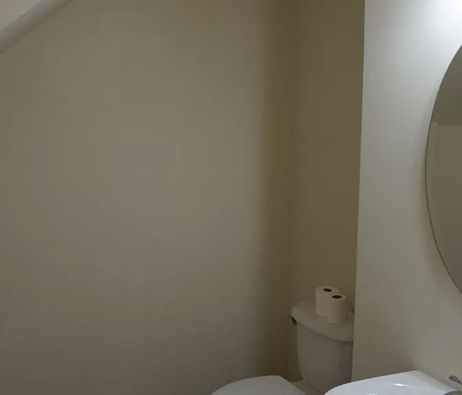 Spacious 1/2 bathroom on main with hardwood floor