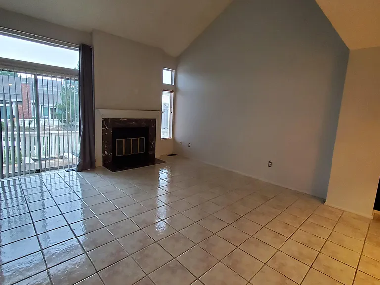 Spacious Living/Dining area with woodburning fireplace