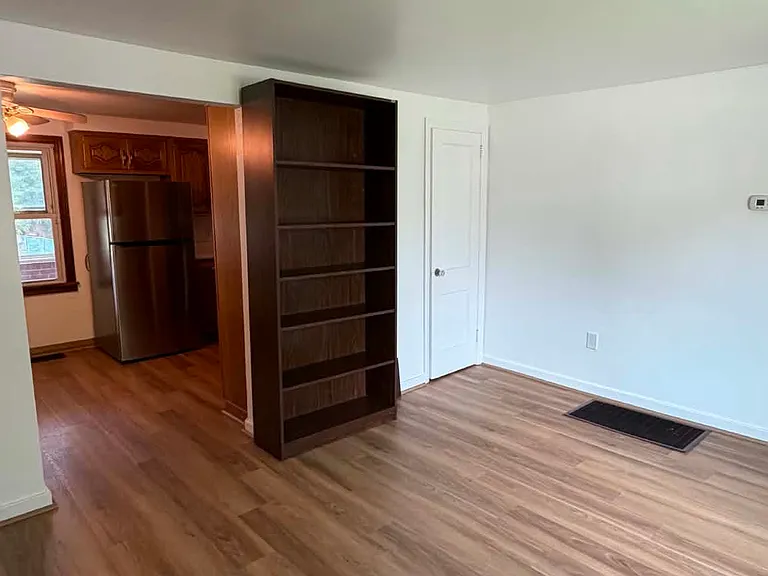Another angle of the living room open to the eat in kitchen