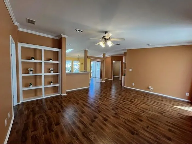 Living room facing open kitchen/dining area