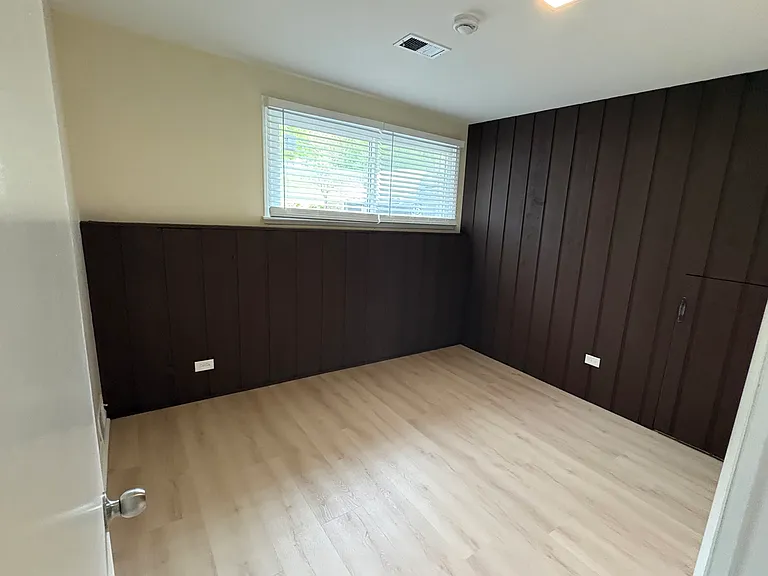 View of 4th bedroom in downstairs living area. Tons of natural light brightening up the room. Perfect for 4th bedroom or work-from-home office