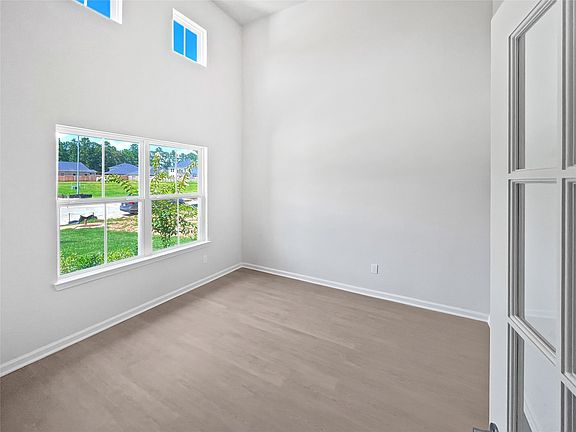 The Princeton II- Study with 2-Story Ceiling and French Doors.