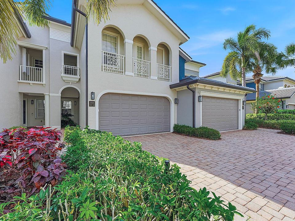 Luxury first-floor coach home with 2.5 bedrooms, 2.5 baths, 2-car garage in gated Estero community