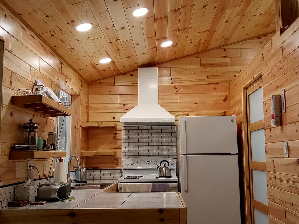 Full kitchen with refrigerator, stove/oven, microwave, 2-basin sink, LOTs of counterspace and storage.