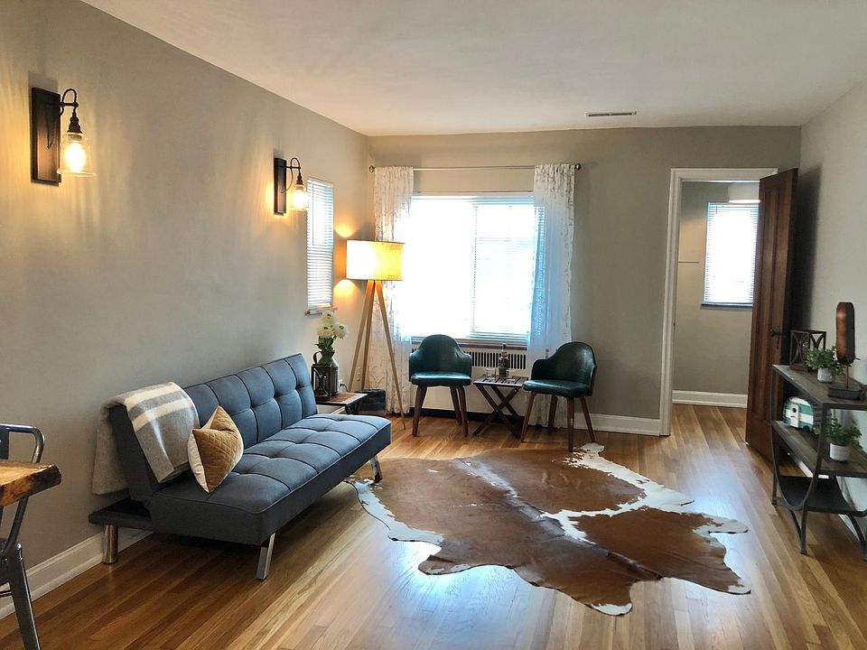 Beautiful picture of the living room. The door to the right is the private office space. There is a lot of natural light.