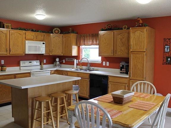 Kitchen with island and eat in area.