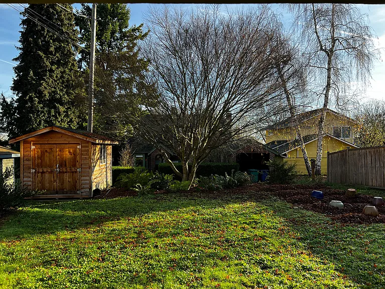 The spacious backyard includes a garden area (if you want to grow veggies or flowers!), a garden shed for extra storage, and a lovely Japanese maple that provides shade in the summer.