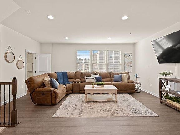 Spacious living room with new floors on entire main level