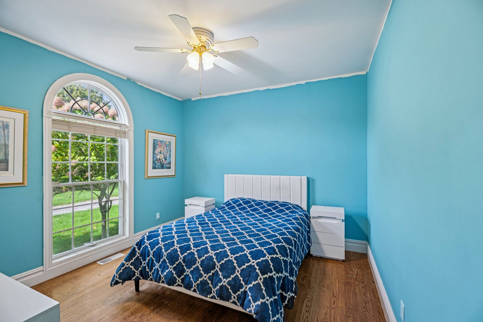 Spacious bedroom with a private full bathroom en suite.