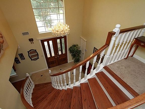 View of  Inviting Entry and Spiral Stairs from Upstairs.