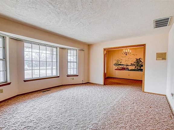 Living room with view of formal dining room