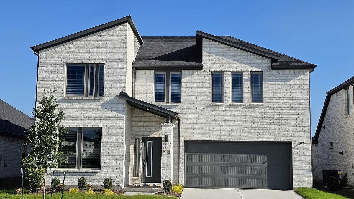 A closer look at the elegant stone and brick detailing that sets this home apart - 907 Pink Skies Dr
