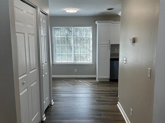 A simple, functional layout that keeps everything connected without feeling crowded. Plenty of room for a desk on the right. Service closets on the left.