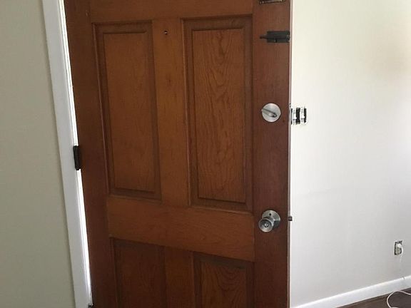 front door - solid wood. There is a security system