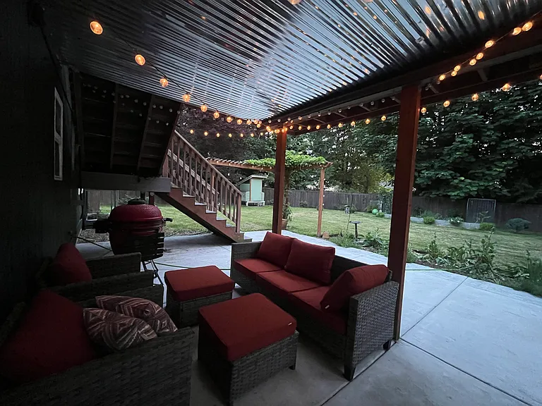 covered patio w/ lawn furniture and smoker (included at tenants request for no additional cost)