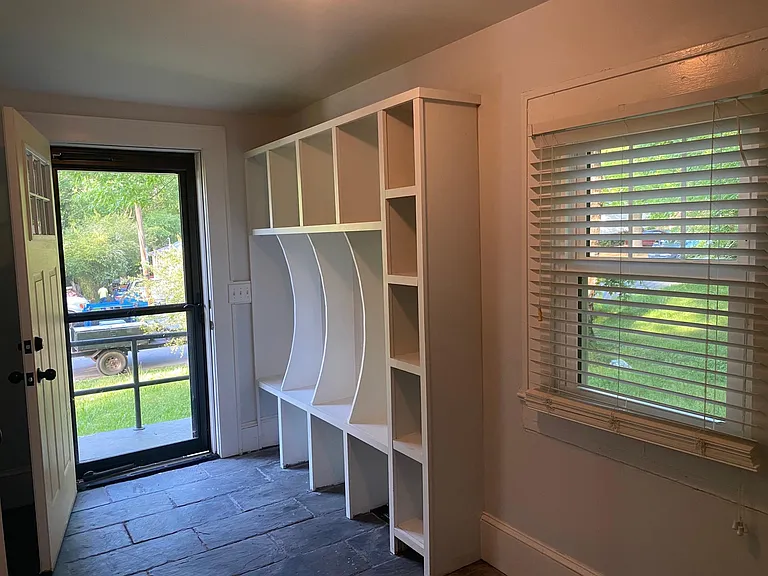 Ample storage in the "Drop-zone" laundry area, and direct access to the side/back yard.