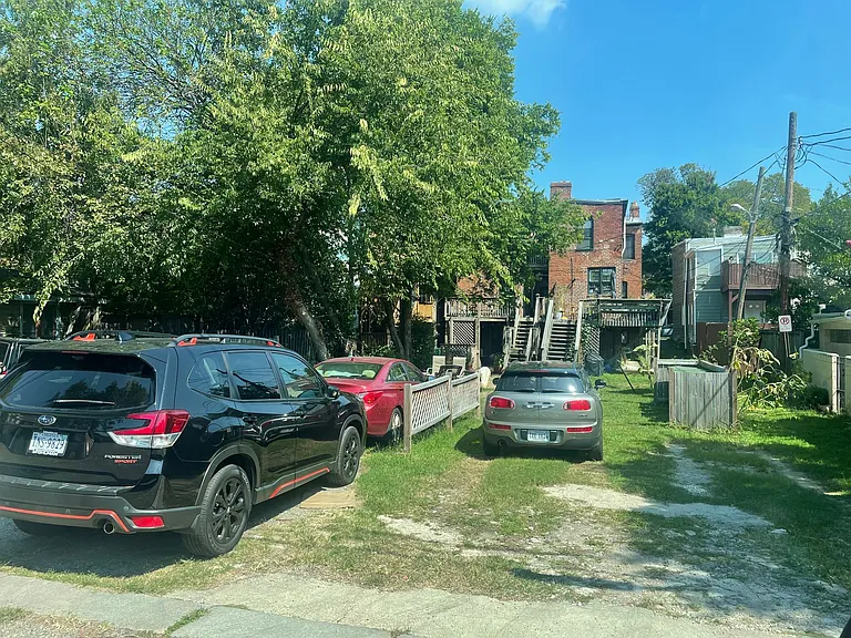 This view is from the back alley where you would park and then walk up steps to enter apt #1.