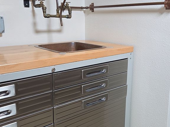 Kitchenette with small copper sink