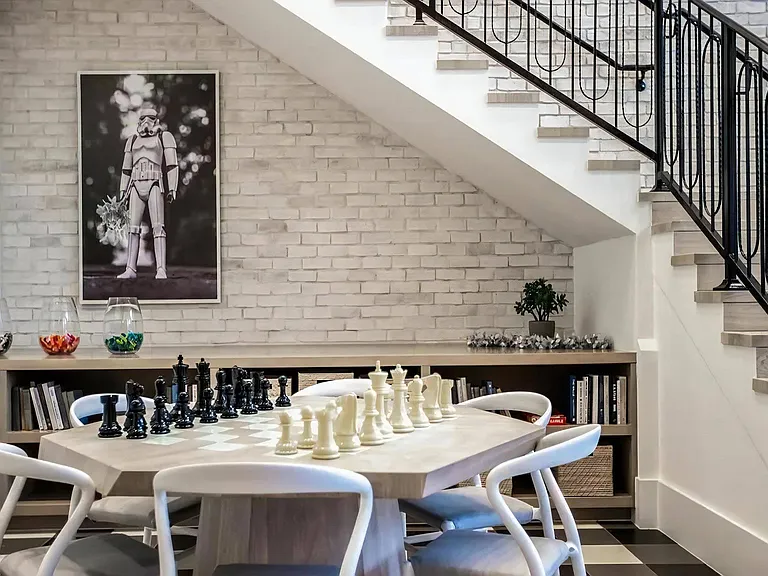 Clubhouse Lounge with Modern Chess Table, Built-In Bookshelves & Artful Decor