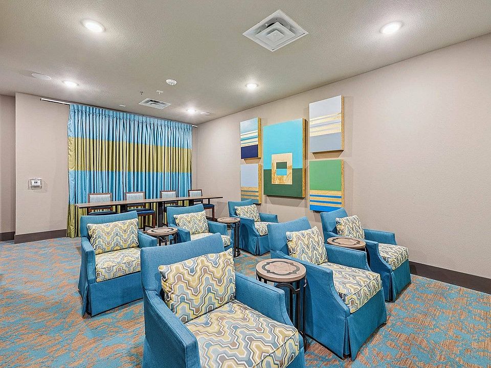 Enjoy movies in style at the McDermott 55 theater, featuring luxury seating and premium sound.