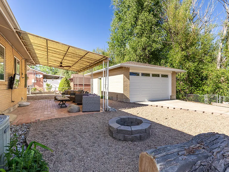 Large, shared backyard space includes a fire pit. Use of fire pit dependent upon local fire restrictions.