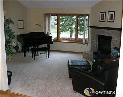 Great room w/ fireplace- new picture window -southern exposure