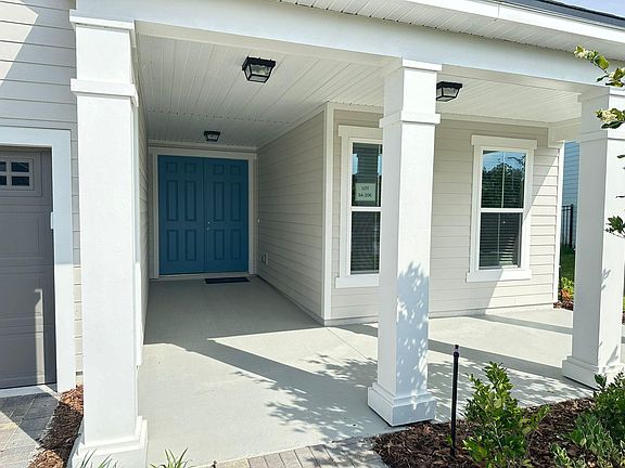 Front extended porch with double door entry