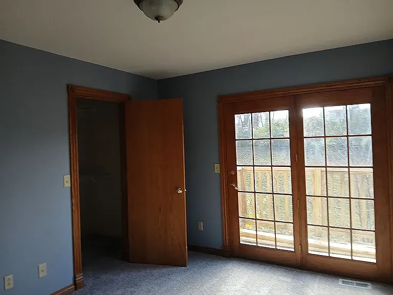 Bedroom with a small balcony