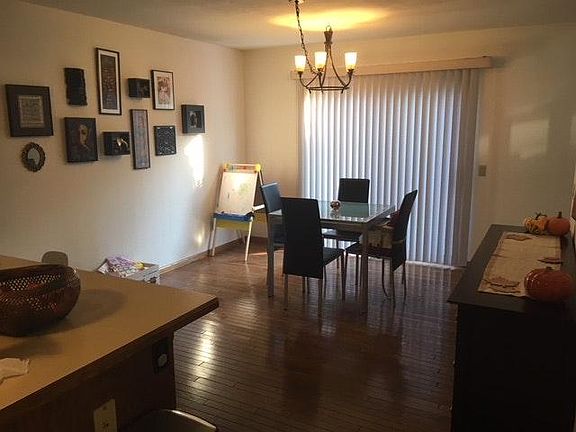 Dining room (kitchen left) with patio exit to side yard.